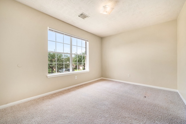 3434 Fiorella Way, Humble, TX 77338 - unfurnished room featuring carpet flooring and a textured ceiling