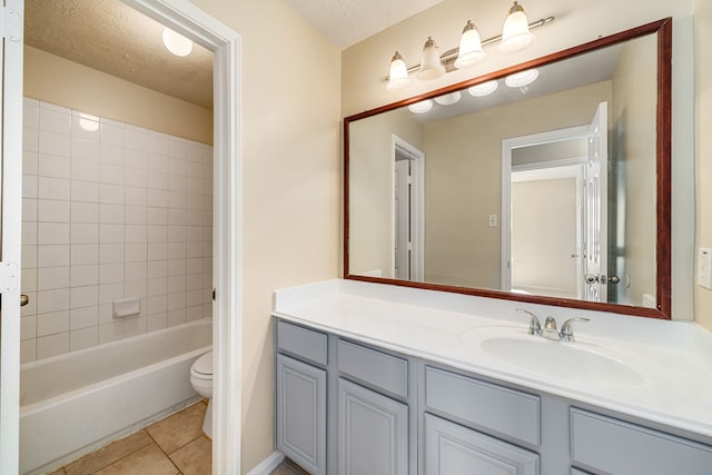 3434 Fiorella Way, Humble, TX 77338 - bathroom with vanity, tile patterned floors,  shower combination, and a textured ceiling