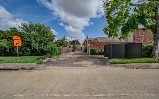 5701 Winsome Ln Unit 2, Houston, TX 77057 - view of concrete road with a gate and traffic signs