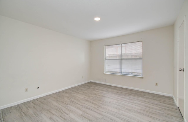 5701 Winsome Ln Unit 2, Houston, TX 77057 - unfurnished room featuring light wood finished floors and recessed lighting