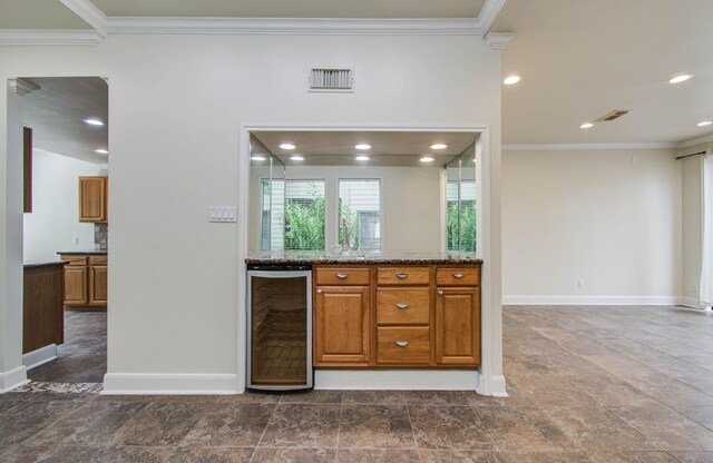 5701 Winsome Ln Unit 2, Houston, TX 77057 - bar featuring beverage cooler, crown molding, and recessed lighting