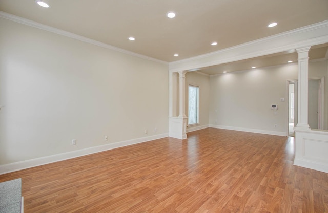 5701 Winsome Ln Unit 2, Houston, TX 77057 - unfurnished room with decorative columns, crown molding, light wood-type flooring, and recessed lighting