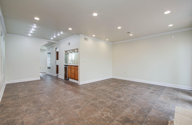 5701 Winsome Ln Unit 2, Houston, TX 77057 - unfurnished living room featuring ornamental molding, recessed lighting, and beverage cooler