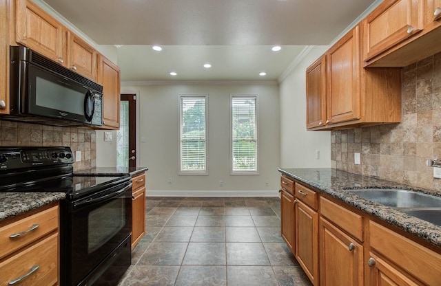 5701 Winsome Ln Unit 2, Houston, TX 77057 - kitchen with black appliances, crown molding, backsplash, recessed lighting, and dark stone countertops