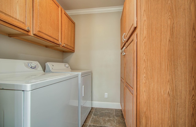 5701 Winsome Ln Unit 2, Houston, TX 77057 - washroom featuring independent washer and dryer, ornamental molding, cabinet space, and dark stone finish floors