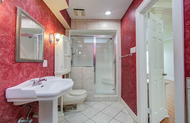 5701 Winsome Ln Unit 2, Houston, TX 77057 - full bathroom featuring wallpapered walls, a shower stall, and tile patterned flooring
