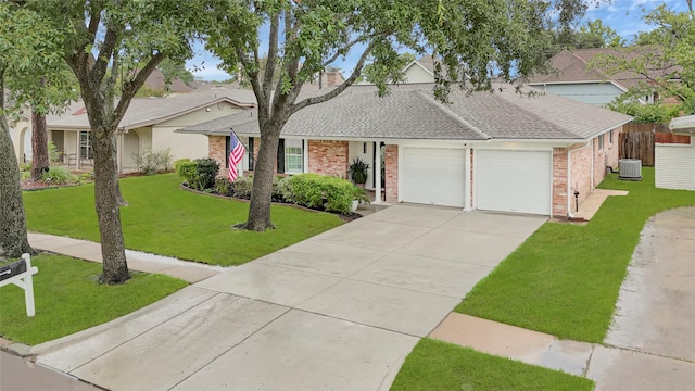 12814 Westmere Dr, Houston, TX 77077 - view of front of home with brick siding, an attached garage, a shingled roof, and concrete driveway