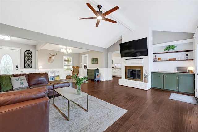 12814 Westmere Dr, Houston, TX 77077 - living room featuring a fireplace, a ceiling fan, dark wood-style flooring, a chandelier, and plenty of natural light