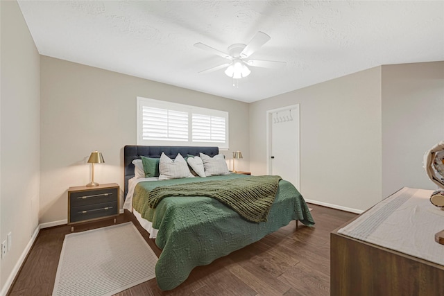 12814 Westmere Dr, Houston, TX 77077 - bedroom featuring a ceiling fan and dark wood-style flooring