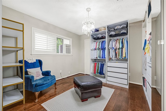 12814 Westmere Dr, Houston, TX 77077 - sitting room featuring a chandelier, wood finished floors, and cooling unit