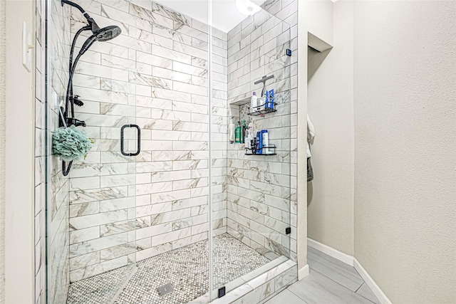 12814 Westmere Dr, Houston, TX 77077 - bathroom with a stall shower and baseboards