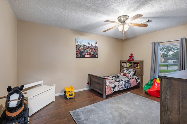 627 S Hyannis Port St, Crosby, TX 77532 - bedroom featuring wood finished floors, a textured ceiling, and a ceiling fan