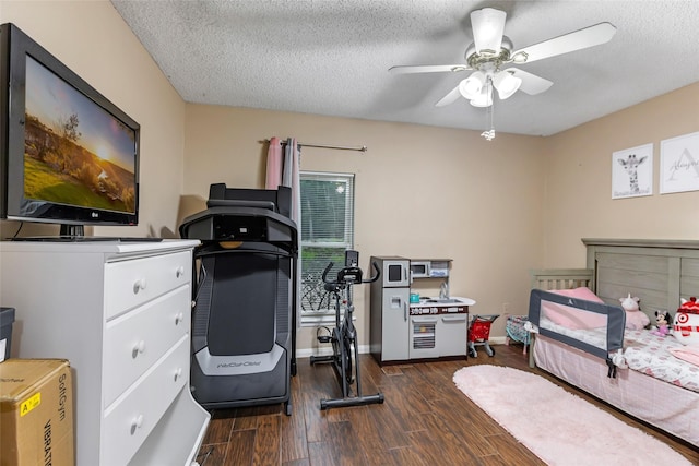 627 S Hyannis Port St, Crosby, TX 77532 - bedroom with dark wood-type flooring, a textured ceiling, and a ceiling fan