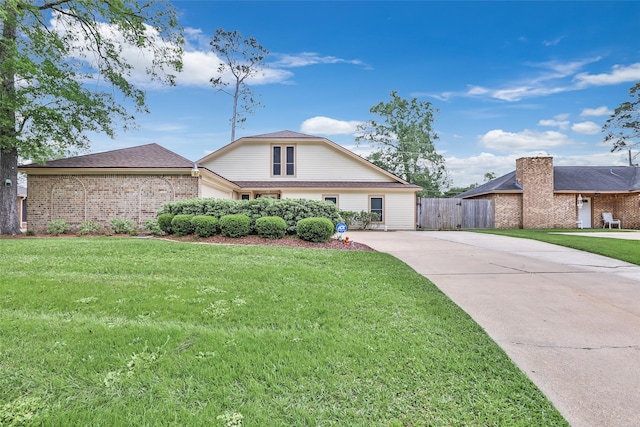 627 S Hyannis Port St, Crosby, TX 77532 - traditional home with concrete driveway and brick siding