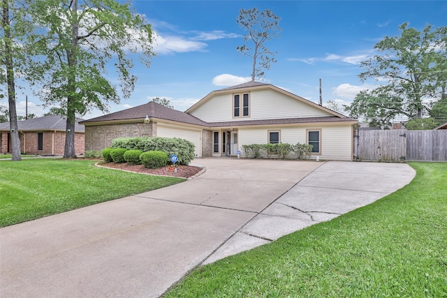 627 S Hyannis Port St, Crosby, TX 77532 - traditional home with driveway, a garage, and brick siding