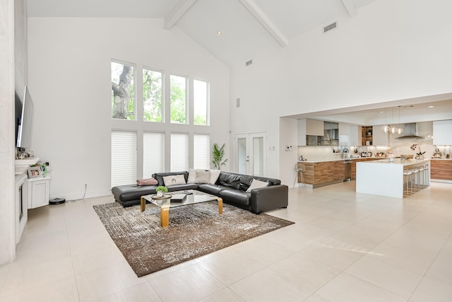 8911 Birdwood Ct, Houston, TX 77096 - living room with high vaulted ceiling, beam ceiling, and light tile patterned flooring