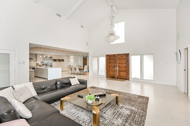 8911 Birdwood Ct, Houston, TX 77096 - living room with high vaulted ceiling, beam ceiling, and light tile patterned floors