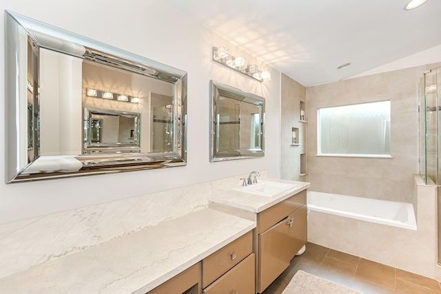 8911 Birdwood Ct, Houston, TX 77096 - bathroom with a bath, vanity, tile patterned flooring, vaulted ceiling, and recessed lighting