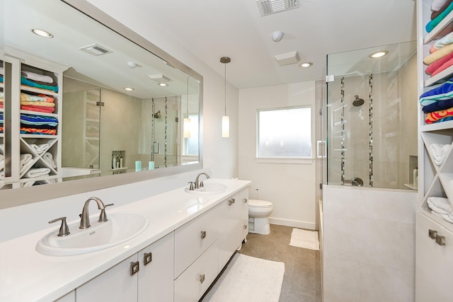 8911 Birdwood Ct, Houston, TX 77096 - bathroom with a shower stall, double vanity, recessed lighting, and tile patterned flooring