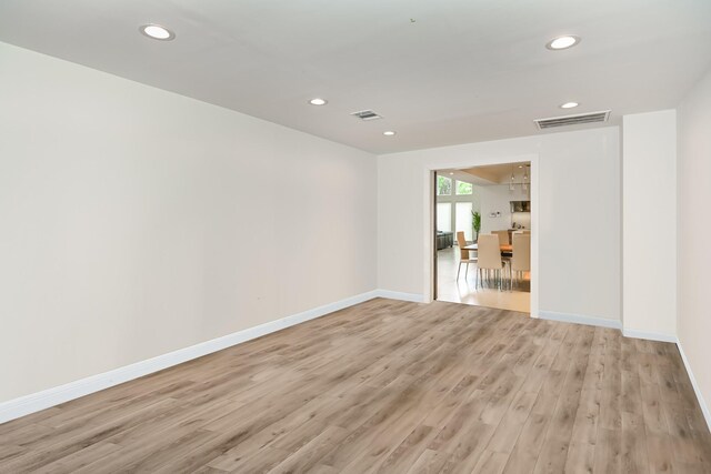 8911 Birdwood Ct, Houston, TX 77096 - unfurnished room with light wood finished floors and recessed lighting