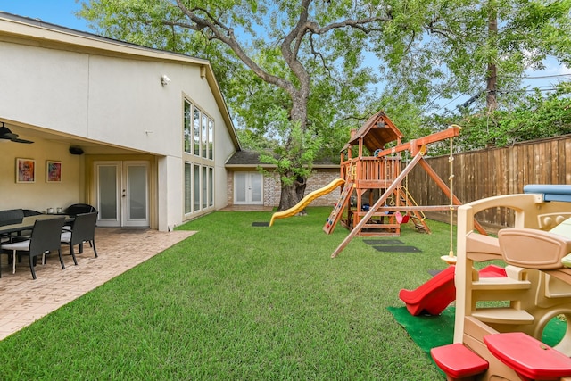 8911 Birdwood Ct, Houston, TX 77096 - fenced yard with a playground, french doors, and a patio