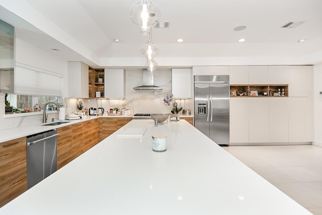 8911 Birdwood Ct, Houston, TX 77096 - kitchen with appliances with stainless steel finishes, modern cabinets, wall chimney exhaust hood, open shelves, and light countertops