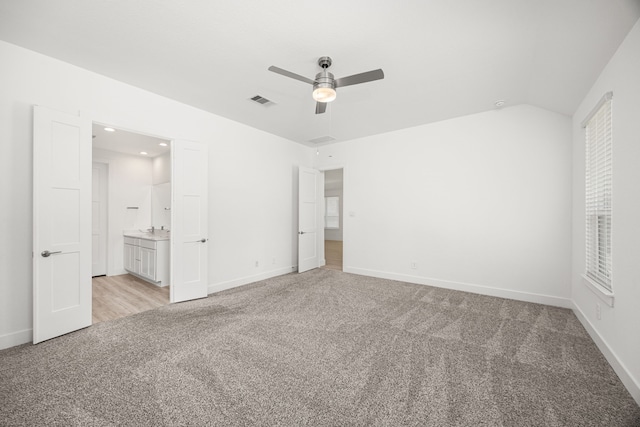15308 Sandhill Crane Ln, Conroe, TX 77384 - unfurnished bedroom featuring light carpet, recessed lighting, ensuite bath, vaulted ceiling, and a ceiling fan