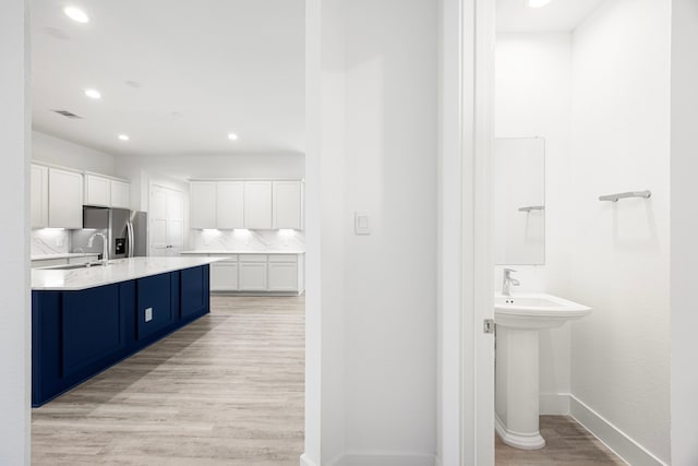15308 Sandhill Crane Ln, Conroe, TX 77384 - bathroom with wood finished floors and recessed lighting