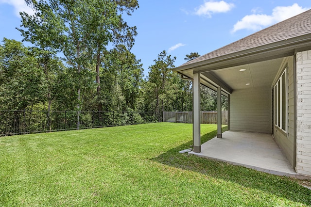 15308 Sandhill Crane Ln, Conroe, TX 77384 - fenced backyard with a patio area