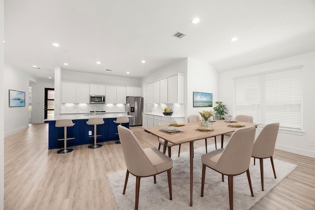 15308 Sandhill Crane Ln, Conroe, TX 77384 - dining space with light wood-style flooring and recessed lighting
