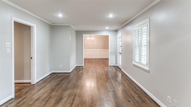5541 Schumacher Ln, Houston, TX 77056 - empty room featuring a chandelier, ornamental molding, dark wood-style flooring, and recessed lighting