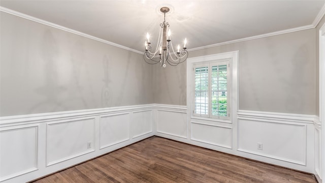 5541 Schumacher Ln, Houston, TX 77056 - unfurnished dining area with a chandelier, ornamental molding, wood finished floors, a wainscoted wall, and a decorative wall