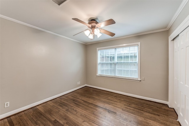 5541 Schumacher Ln, Houston, TX 77056 - unfurnished bedroom featuring dark wood-type flooring, a closet, crown molding, and a ceiling fan