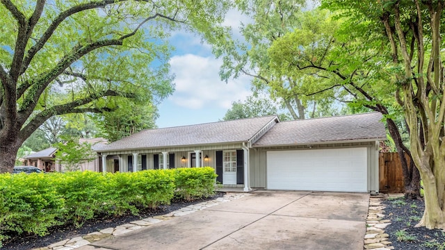5541 Schumacher Ln, Houston, TX 77056 - single story home featuring a garage, driveway, and roof with shingles