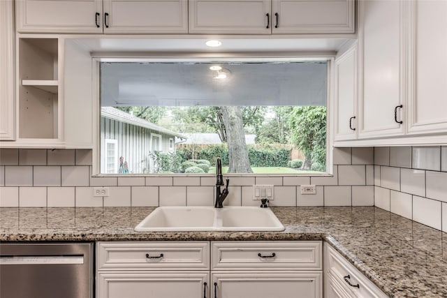 5541 Schumacher Ln, Houston, TX 77056 - kitchen with dishwasher, white cabinetry, decorative backsplash, and light stone counters
