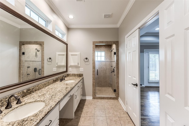 5541 Schumacher Ln, Houston, TX 77056 - full bathroom featuring a stall shower, plenty of natural light, double vanity, ornamental molding, and tile patterned flooring