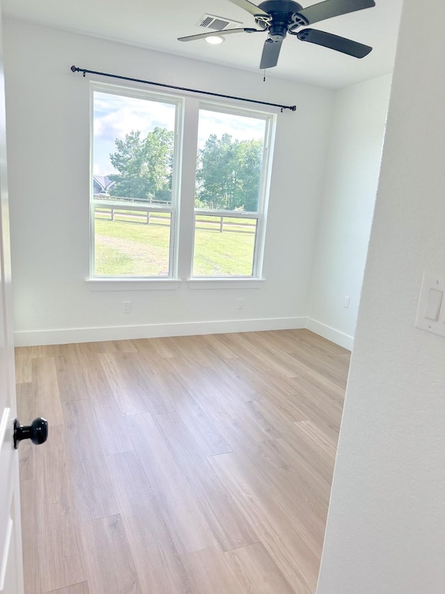 1310 Denson Allen, Coldspring, TX 77331 - unfurnished room with light wood finished floors and a ceiling fan