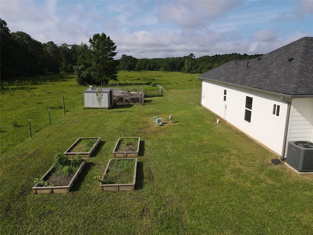 1310 Denson Allen, Coldspring, TX 77331 - view of grassy yard featuring a garden