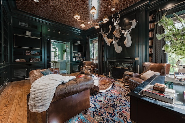 1069 Kirby Dr, Houston, TX 77019 - living area featuring crown molding and a fireplace