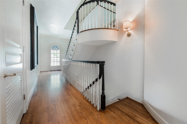 1069 Kirby Dr, Houston, TX 77019 - staircase with wood finished floors and baseboards