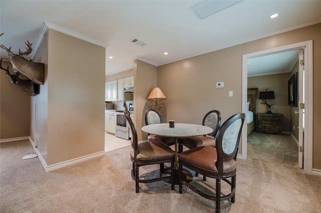 1069 Kirby Dr, Houston, TX 77019 - dining space featuring light colored carpet, crown molding, recessed lighting, and a wood stove