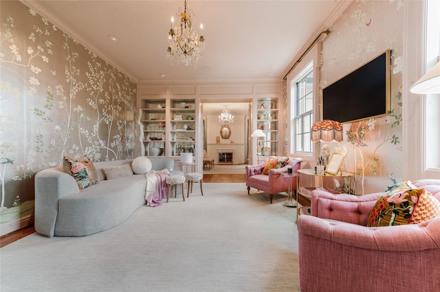 1069 Kirby Dr, Houston, TX 77019 - living room with a chandelier, crown molding, built in features, a fireplace, and wallpapered walls