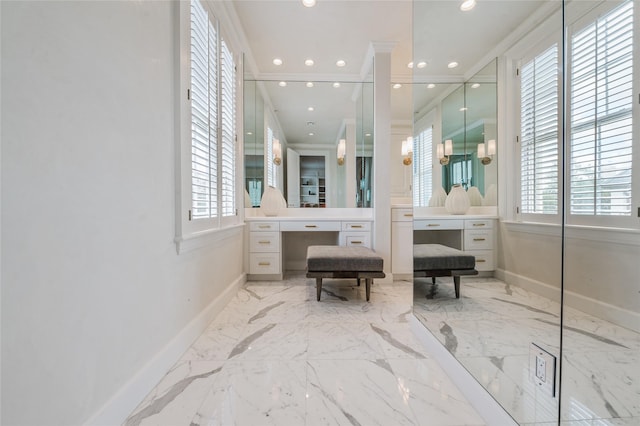 1069 Kirby Dr, Houston, TX 77019 - full bathroom with ornamental molding, marble tiled floors, vanity, and recessed lighting