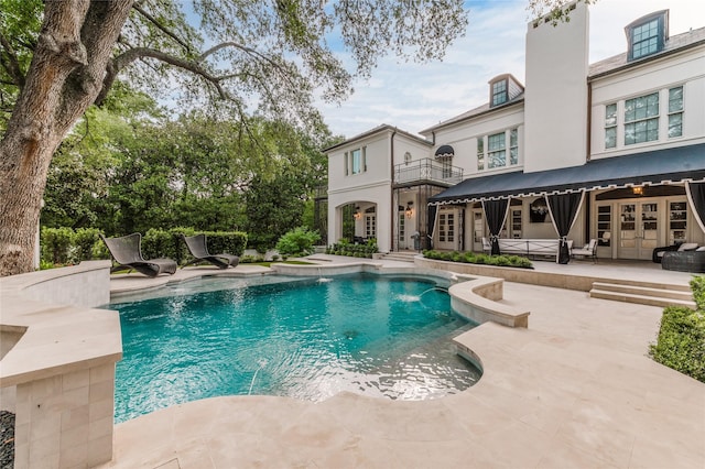 1069 Kirby Dr, Houston, TX 77019 - swimming pool with a patio area and french doors