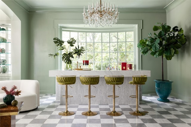 1069 Kirby Dr, Houston, TX 77019 - bar area with tile patterned floors, a chandelier, and ornamental molding