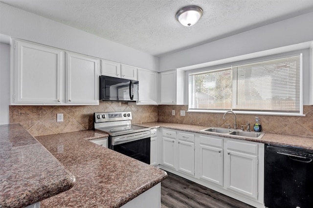 1602 Evesham Dr, Houston, TX 77015 - kitchen featuring black appliances, dark wood-type flooring, white cabinets, a textured ceiling, and tasteful backsplash