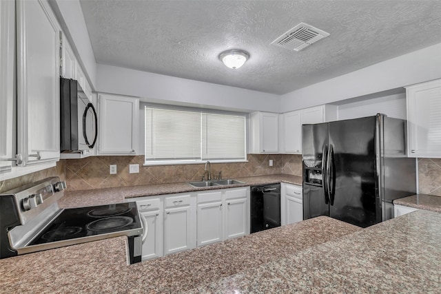 1602 Evesham Dr, Houston, TX 77015 - kitchen featuring black appliances, backsplash, a textured ceiling, and white cabinetry