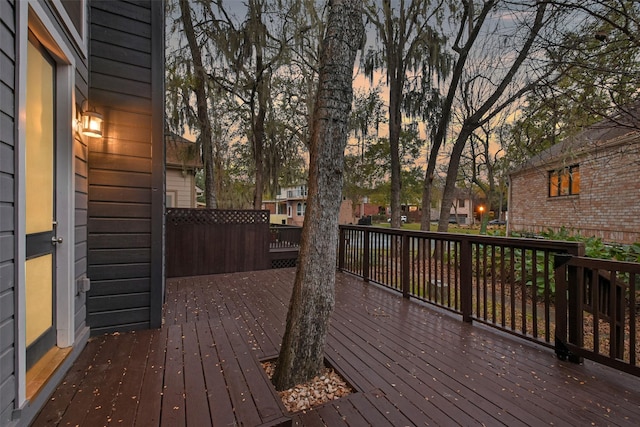 12859 Kingsbridge Ln, Houston, TX 77077 - deck at dusk featuring a residential view