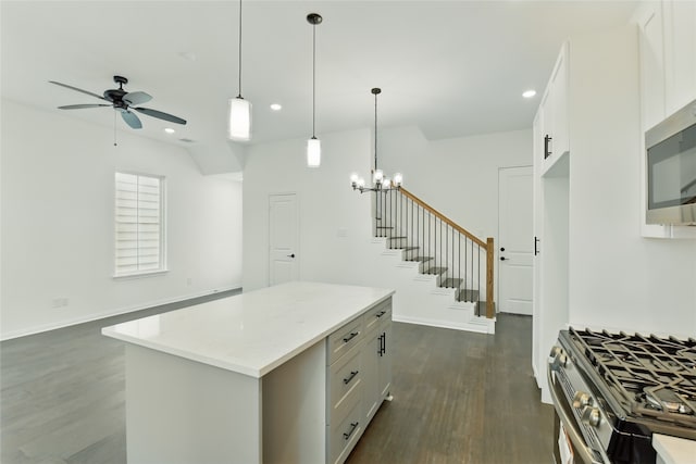 9902 Clark Rd Unit D, Houston, TX 77076 - kitchen with dark wood-type flooring, a ceiling fan, white cabinets, recessed lighting, and appliances with stainless steel finishes