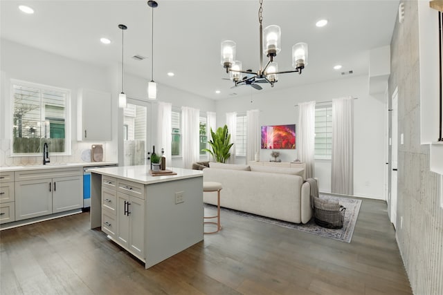 9902 Clark Rd Unit D, Houston, TX 77076 - kitchen featuring a chandelier, open floor plan, recessed lighting, light countertops, and dishwasher